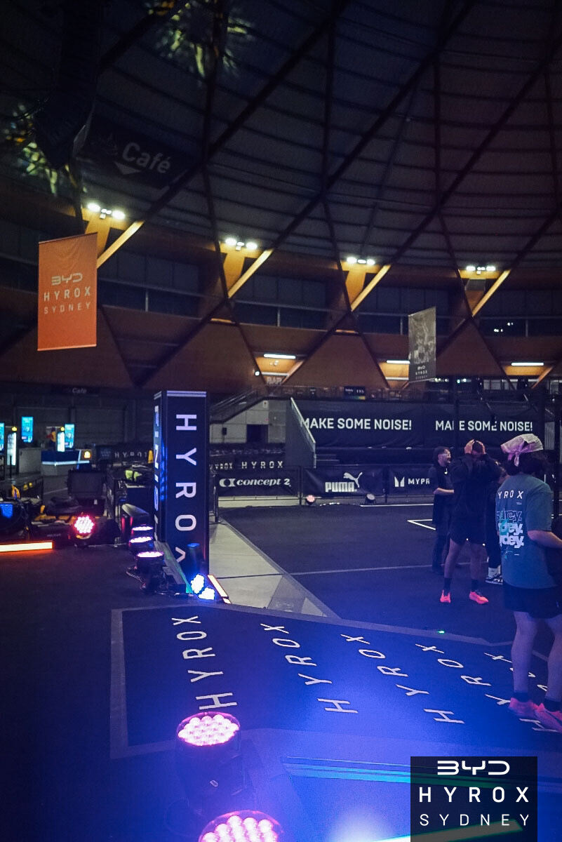 Athletes approaching the finish line after hybrid race training